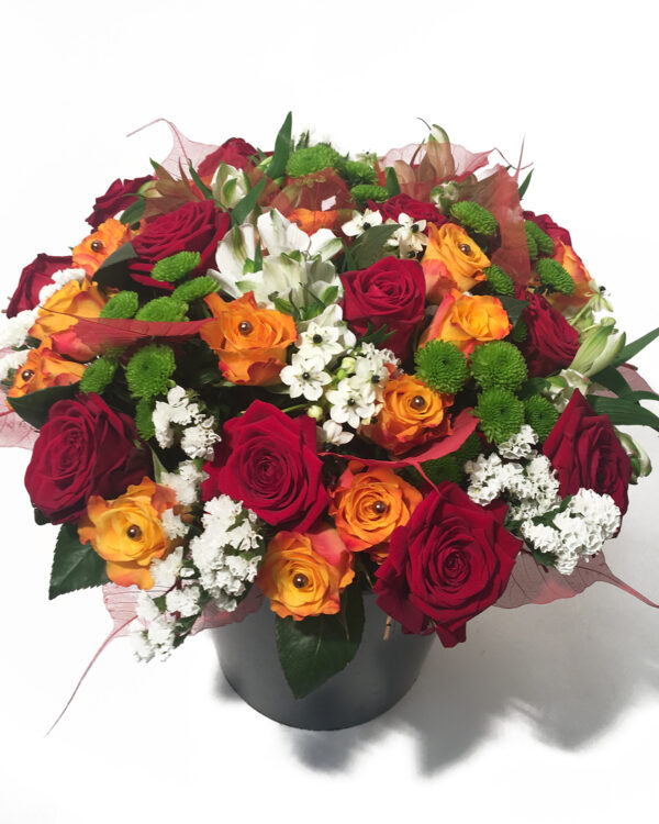 Big bouquet of red and orange roses and other flowers