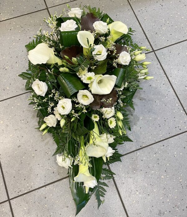 Funeral arrangement of  white callas and tulips