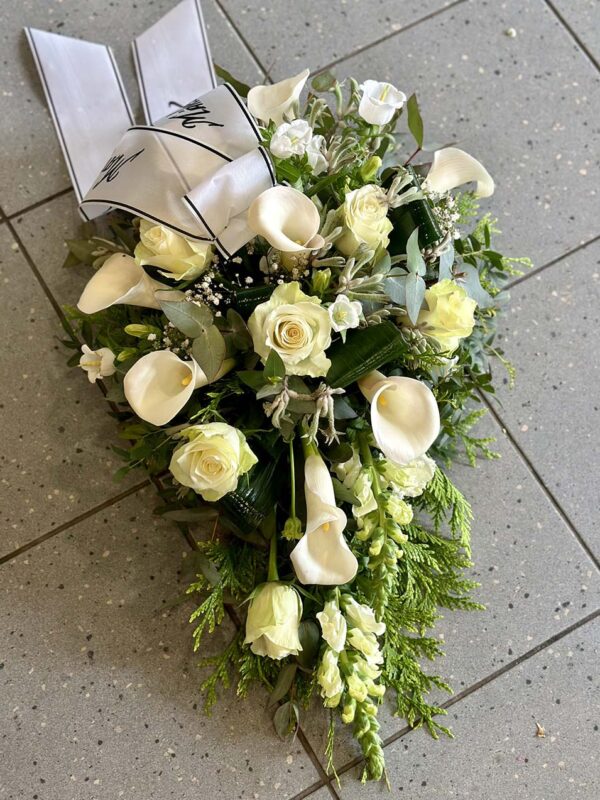 Funeral arrangement: white callas and roses