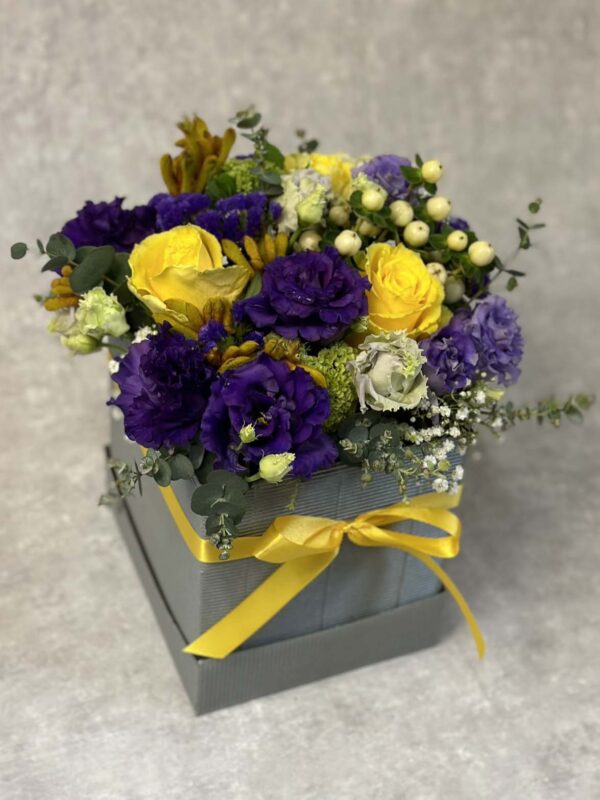 Stylish giftbox with yellow and blue flowers