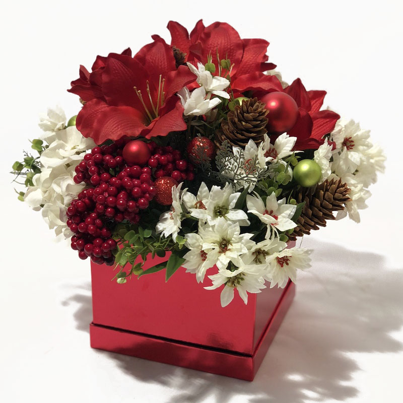 Red flowerbox with artificial Christmas flowers- red and white